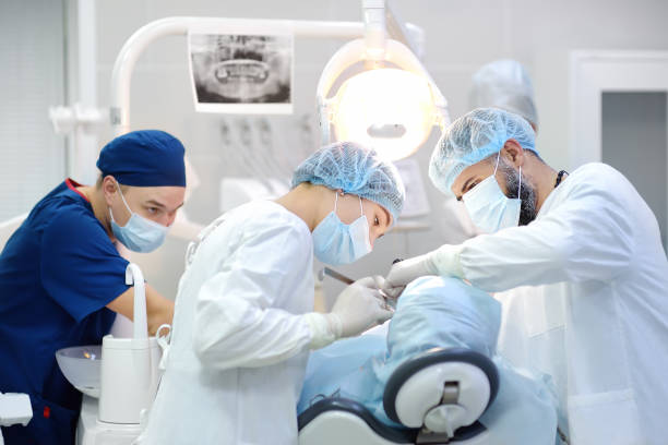dental professionals working on a patient under sedation
